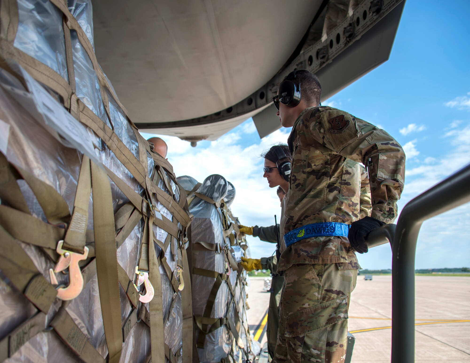 U.S. Air Force Senior Airman Megan Lenling and Airman First Class Isaac Johnson, both Air Transportation Specialists with the 133rd Airlift Wing’s Air Transportation Function onload medical cargo during a recent Denton Humanitarian Assistance Program mission  in St. Paul, Minn., June 13, 2020.