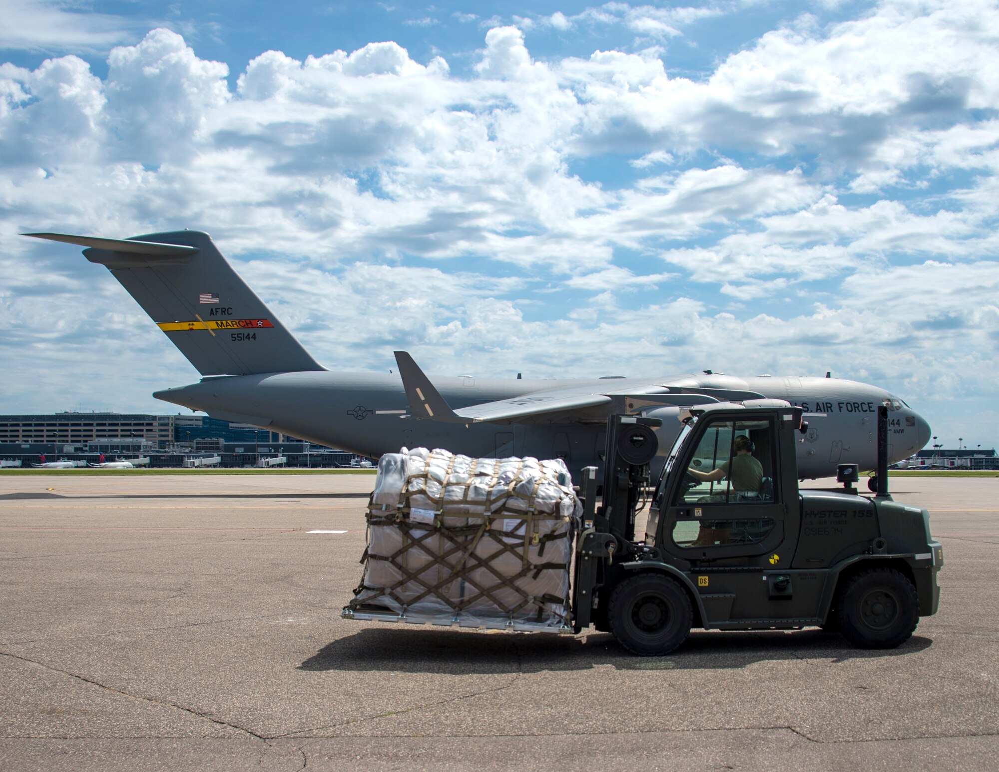 An airman awaits the ability to load a pallet of medical supplies palletized by members of the 133rd Airlift Wing’s Air Transportation Function in St. Paul, Minn., June 13, 2020.