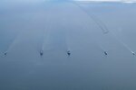 From left, the British Royal Navy Duke-class frigate HMS Kent (F78), the Supply-class combat support ship USNS Supply (T-AOE 6), the Blue Ridge-class command and control ship USS Mount Whitney (LCC 20), the Royal Danish Navy Absalon-class support ship HDMS Esbern Snare (L17) and the Swedish Royal Navy Visby-class corvette HMS Karlstad (K35) sail in formation in the Baltic Sea while a U.S. Air Force B-52H Stratofortress long-range bomber flies overhead during exercise Baltic Operations (BALTOPS) 2020, June 15, 2020. BALTOPS is the premier annual maritime-focused exercise in the Baltic Region, marking the 49th year of one of the largest exercises in Northern Europe enhancing flexibility and interoperability among allied and partner nations.