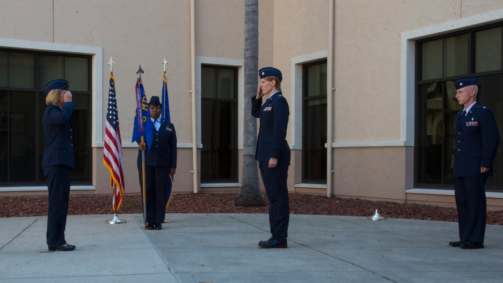 U.S. Air Force Col. Christine Berberick, the 6th Medical Group commander, salutes Lt. Col. Ann McManis, the 6th Medical Support Squadron commander, during a change of command ceremony, June 11, 2020, at MacDill Air Force Base, Fla.