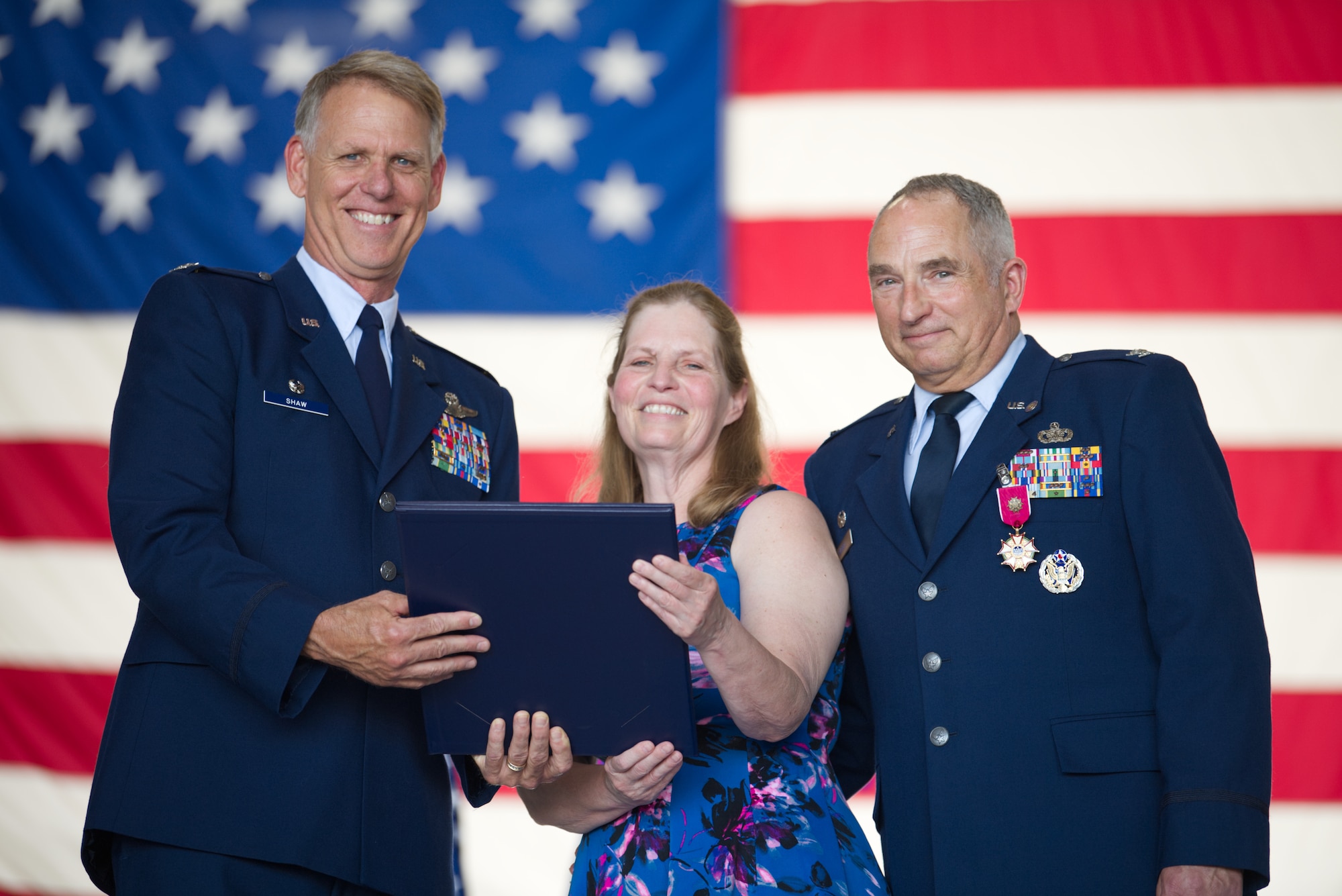 Col. Larry Shaw, 434th Air Refueling Wing commander, presents Terri Russell with a certificate of appreciation at Grissom Air Reserve Base, Ind., June 6, 2020. Russell was honored at the retirement ceremony of her husband, Col. Scott Russell, for her work with Grissom’s Key Spouse Program. (U.S. Air Force photo / A1C Harrison Withrow)