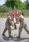 Lt. Col. Robert J. Kincaid recieves the command guideon from Brig. Gen. Russell Crane, Assistant Adjutant General, as he assumes command of the West Virginia National Guard's 111th Engineer Brigade in Eleanor, Saturday, June 13, 2020. The ceremony was held outdoors with family and friends in attendance. (U.S. Army National Guard photo by Edwin L. Wriston)
