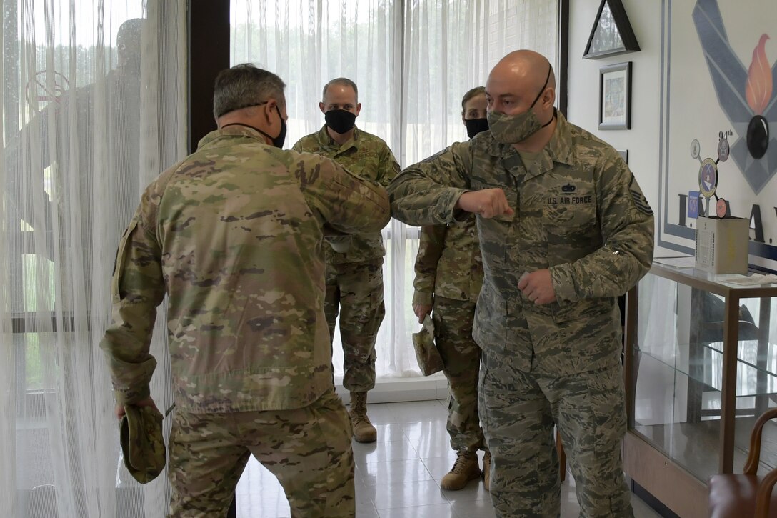 Master Sgt. Vincent Lopez, Munitions Accountable Systems Officer/Munitions Flight Chief, 94th Airlift Wing, Dobbins Air Reserve Base, receives a recognition slip from Col. Craig McPike, Commander of the 94th Airlift Wing, Dobbins ARB at the munitions facility on June 6, 2020. Lopez was a recent Air Force Reserve Command award winner for Outstanding Munitions Maintenance. (U.S. Air Force photo by Senior Airman Justin Clayvon)