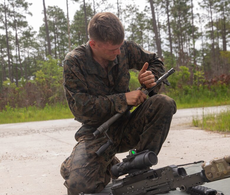 U.S. Marine Corps Lance Cpl. Christophe Wilson, a rifleman with 2nd Light Armored Reconnaissance Battalion, 2nd Marine Division, assembles an M240B machine gun during the Isaak Competition at Camp Geiger, North Carolina, June 9, 2020. 2nd LAR host the annual competition to honor Cpl. Garreth Isaak a LAR Marine who earned the Silver Star posthumously for actions during Operation Just Cause. (U.S. Marine Corps photo by Lance Cpl. Reine Whitaker)