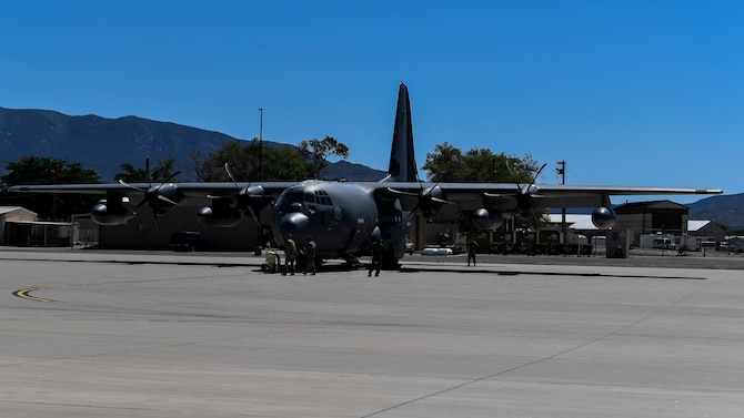 Airmen perform a pre-flight inspection.