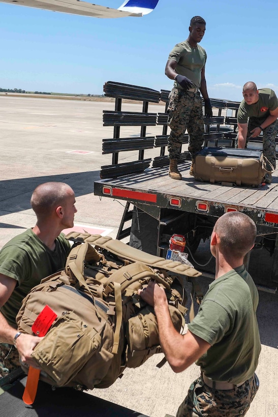U.S. Marines with Special Purpose Marine Air-Ground Task Force-Crisis Response-Africa 20.2, Marine Forces Europe and Africa, load gear onto a vehicle after arriving at Móron Air Base, Spain June 9, 2020. SPMAGTF-CR-AF 20.2 is deployed to conduct crisis-response and theater-security operations in Africa and promote regional stability by conducting military-to-military training exercises throughout Europe and Africa. SPMAGTF-CR-AF 20.2 continues to work closely with the relevant medical agencies and military organizations to minimize risk of COVID-19 exposure. (U.S. Marine Corps photo by Cpl. Tawanya Norwood)