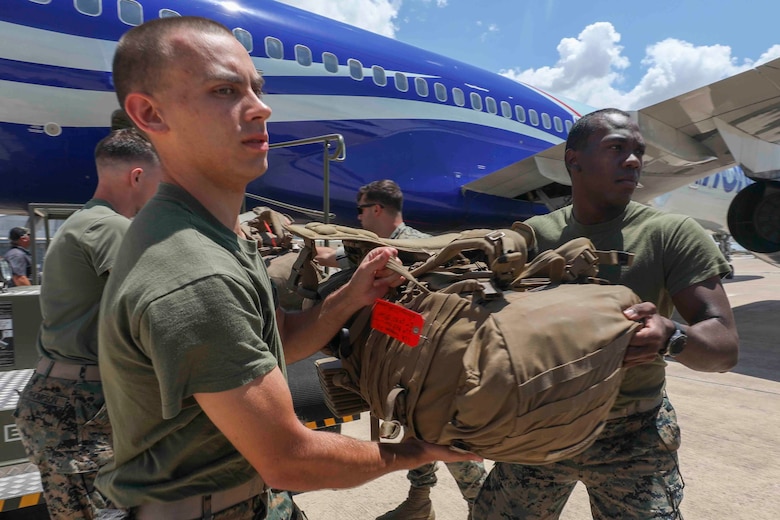 U.S. Marines with Special Purpose Marine Air-Ground Task Force-Crisis Response-Africa 20.2, Marine Forces Europe and Africa, offload gear from a plane after arriving at Móron Air Base, Spain, June 9, 2020. SPMAGTF-CR-AF 20.2 deployed to conduct crisis-response and theater-security operations in Africa and promote regional stability by conducting military-to-military training exercises throughout Europe and Africa. SPMAGTF-CR-AF 20.2 continues to work closely with the relevant medical agencies and military organizations to minimize risk of COVID-19 exposure. (U.S. Marine Corps photo by Cpl. Tawanya Norwood)