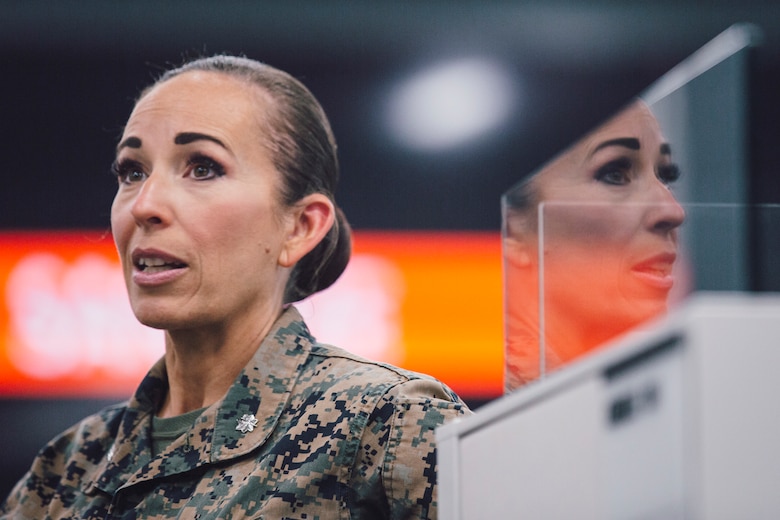 U.S. Marine Corps Lt. Col. Juliet Calvin, the commanding officer of 1st Network Battalion, Marine Corps Cyberspace Operations Group, conducts a walkthrough of the battalion workspaces at Marine Corps Base Camp Pendleton, California, June 4, 2020. 1st Network Bn., the first of six new Marine Corps network units, was created to improve oversight, command, and control of the Marine Corps enterprise network while managing building and local area networks around base. (U.S. Marine Corps photo by Staff Sgt. Donald Holbert)