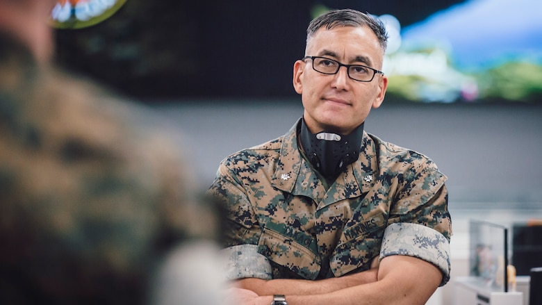 U.S. Marine Corps Lt. Col. Koichi Takagi, second from right, the assistant chief of staff G-6 for Marine Corps Installations - West, speaks to Marines at their workstations during a walkthrough at Marine Corps Base Camp Pendleton, California, June 4, 2020. 1st Network Bn., the first of six new Marine Corps network units, was created to improve oversight, command, and control of the Marine Corps enterprise network while managing building and local area networks around base. (U.S. Marine Corps photo by Staff Sgt. Donald Holbert)