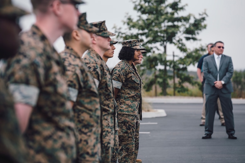 U.S. Marines and civilians currently assigned to 1st Network Battalion, Marine Corps Cyberspace Operations Group, stand in formation during the battalion transfer of authority at Marine Corps Base Camp Pendleton, California, June 4, 2020. 1st Network Bn., the first of six new Marine Corps network units, was created to improve oversight, command, and control of the Marine Corps enterprise network while managing building and local area networks around base. (U.S. Marine Corps photo by Staff Sgt. Donald Holbert)