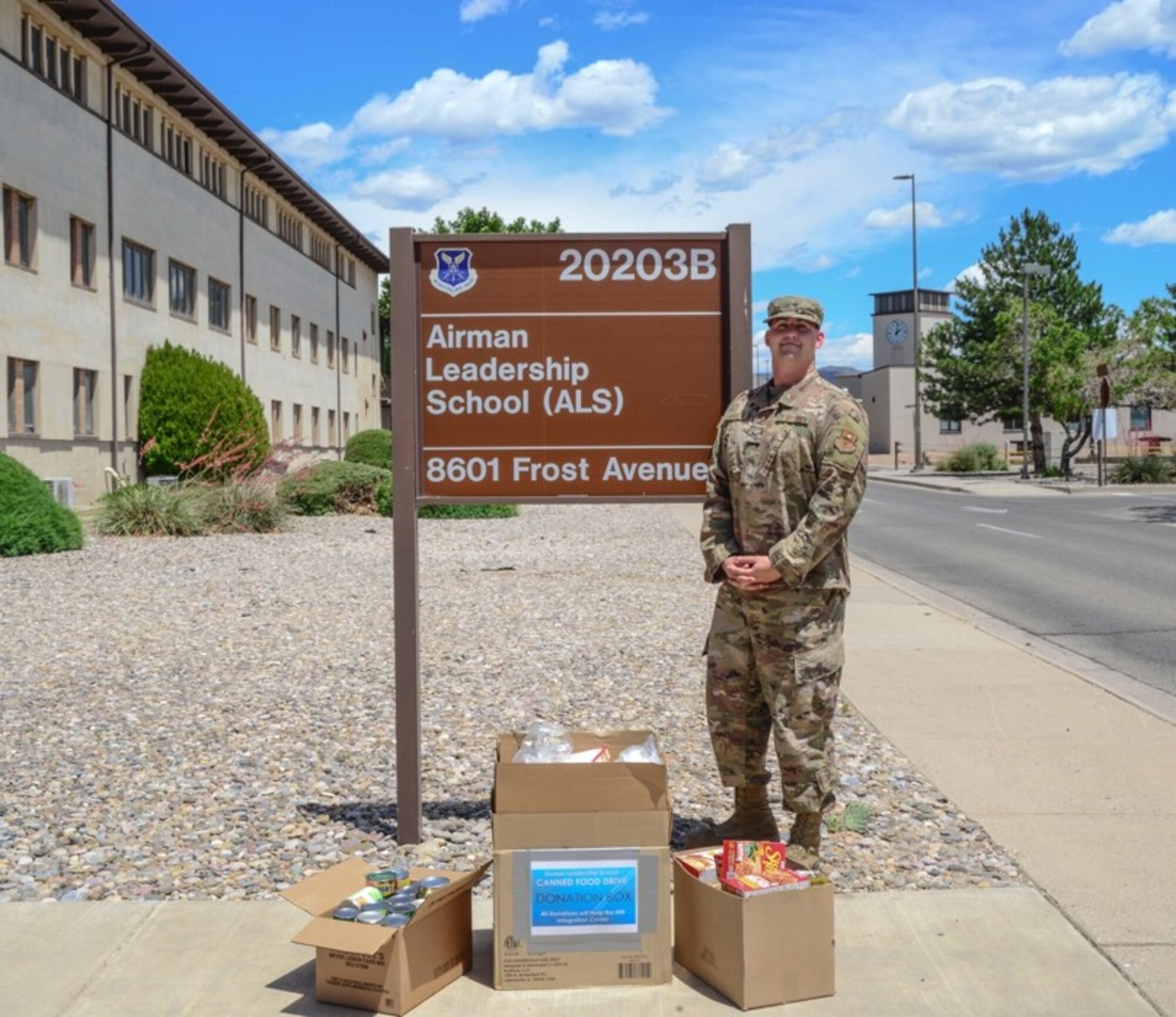 Airman stands with donated goods