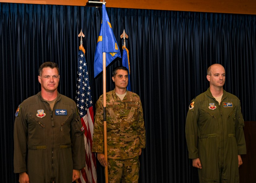 A photo of three airmen standing at attention