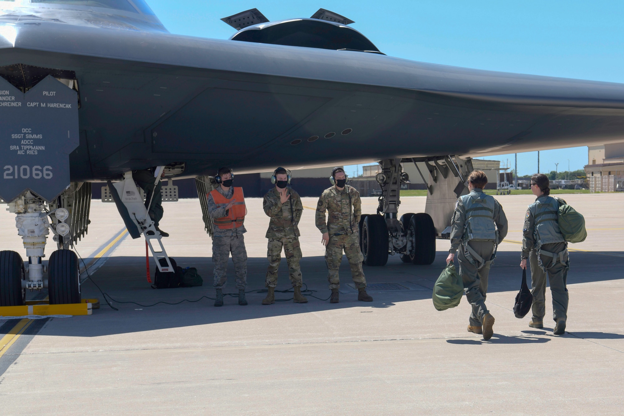 Secretary of the Air Force Barbara Barrett and Lt. Col. Nicola Polidor, the Det. 5, 29th Training Systems Squadron commander and B-2 Spirit stealth bomber pilot, are greeted by 509th Aircraft Maintenance Squadron crew chiefs prior to a familiarization flight for Barrett during a visit at Whiteman Air Force Base, Missouri, June 11, 2020. During her visit, Barrett spoke with base leaders, first responders and maintenance personnel across the installation to learn the B-2 Spirit stealth bomber’s critical role of global deterrence as part of the nuclear triad. (U.S. Air Force photo by Staff Sgt. Dylan Nuckolls)