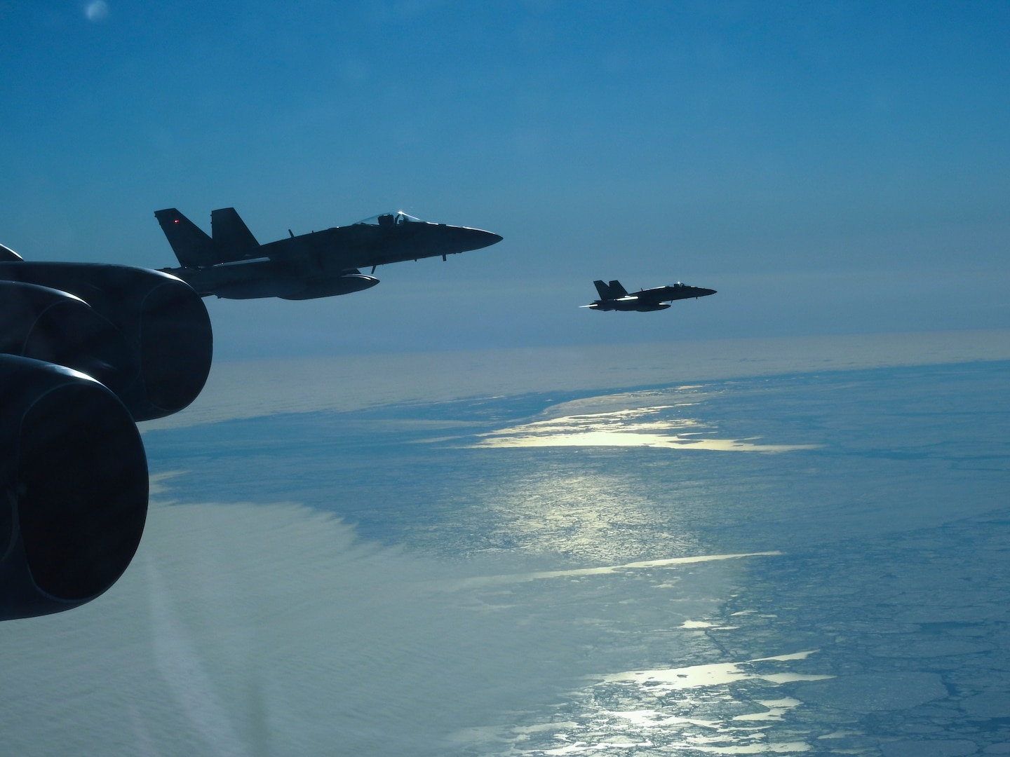 A Royal Canadian Air Force CF-18 Hornet, assigned to the Royal Canadian Air Force, escorts a B-52 Stratofortress during a North American Aerospace Defense Command (NORAD) mission, June 14, 2020. NORAD routinely conducts intercept training in support of its mission to protect the sovereign airspaces of the United States and Canada. (Courtesy Photo)