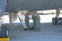 Secretary of the Air Force Barbara Barrett (right) and Lt. Col. Nicola Polidor, the Det. 5, 29th Training Systems Squadron commander and B-2 Spirit stealth bomber pilot, center, and, review flight paperwork prior to a familiarization flight for Barrett during a visit at Whiteman Air Force Base, Missouri, June 11, 2020. During her visit, Barrett spoke with base leaders, first responders and maintenance personnel across the installation to learn the B-2 Spirit stealth bomber’s critical role of global deterrence as part of the nuclear triad. (U.S. Air Force photo by Staff Sgt. Dylan Nuckolls)