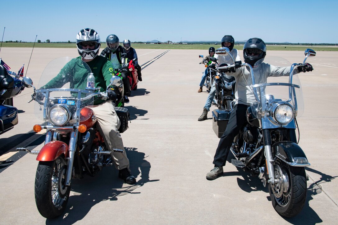 people ride on motor cycles