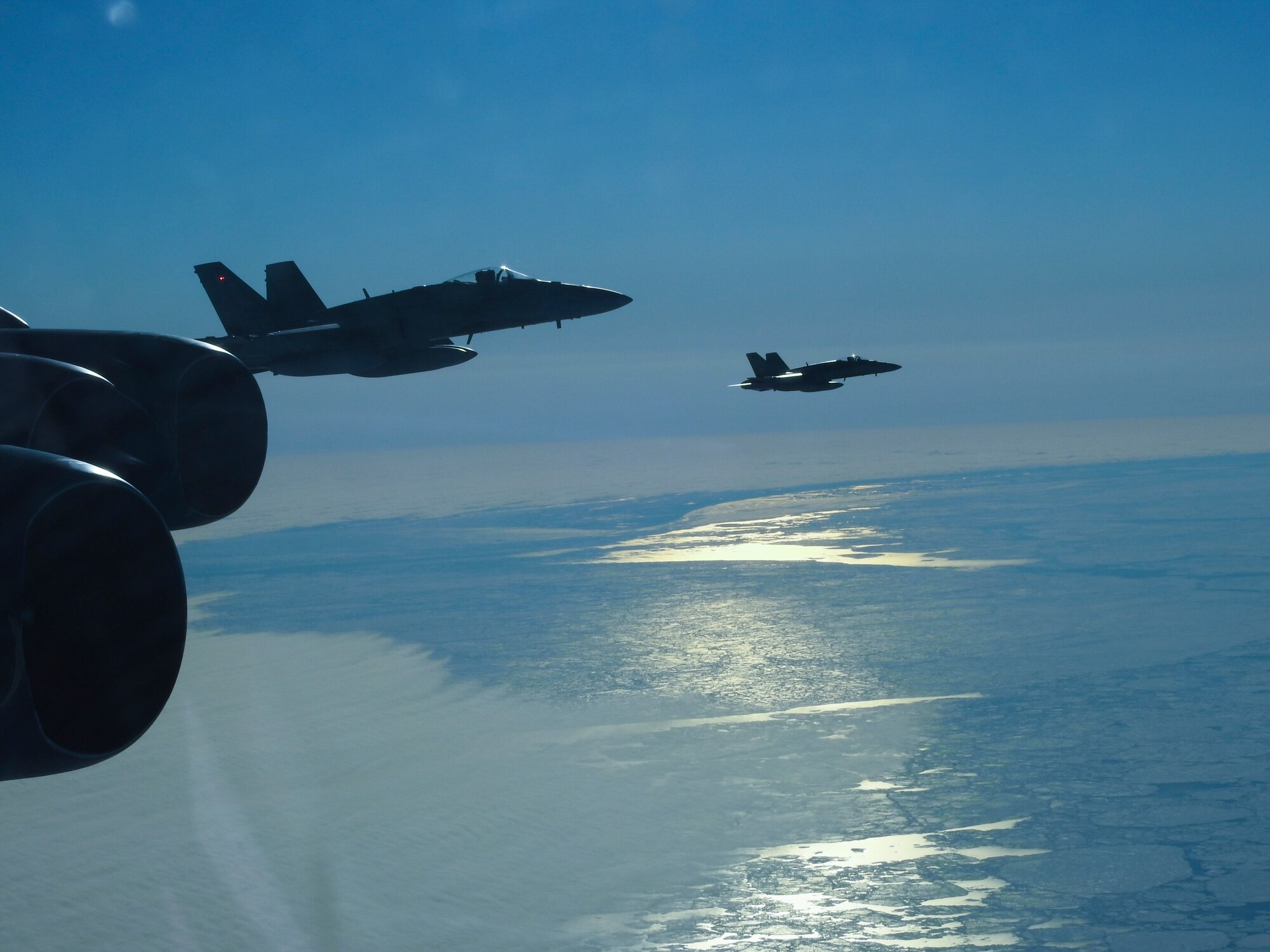A Royal Canadian Air Force CF-18 Hornet, assigned to the Royal Canadian Air Force, escorts a B-52 Stratofortress during a North American Aerospace Defense Command (NORAD) mission, June 14, 2020. NORAD routinely conducts intercept training in support of its mission to protect the sovereign airspaces of the United States and Canada. (Courtesy Photo)