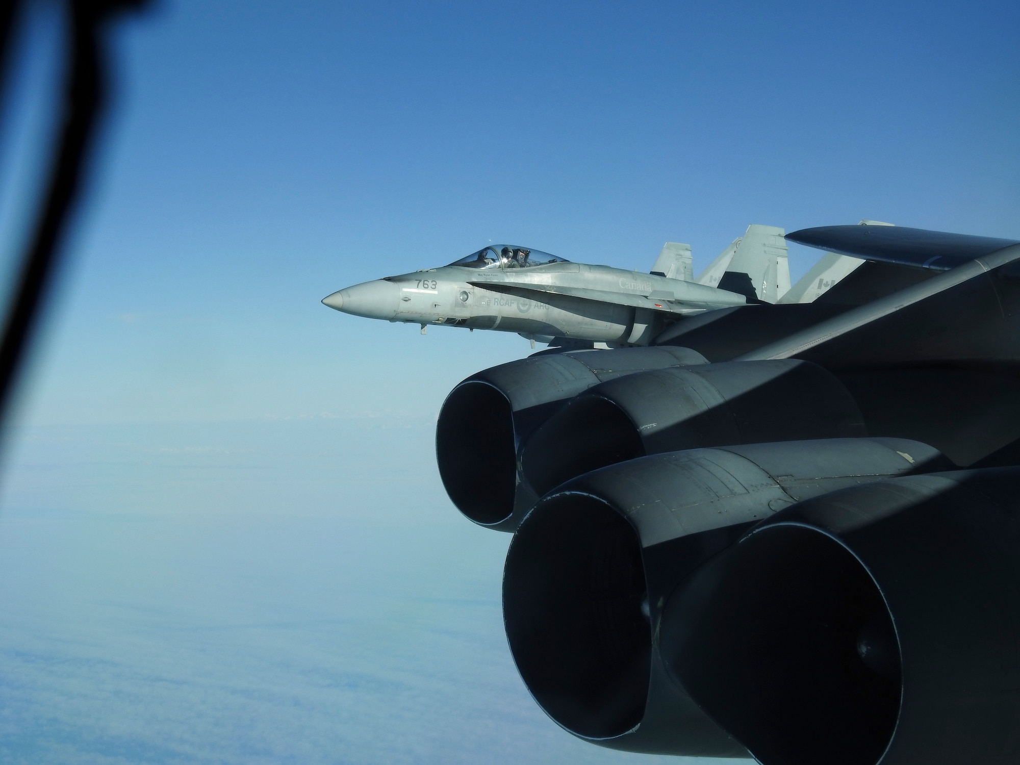 A Royal Canadian Air Force CF-18 Hornet, escorts a B-52 Stratofortress during a North American Aerospace Defense Command (NORAD) mission, June 14, 2020. NORAD routinely conducts intercept training in support of its mission to protect the sovereign airspaces of the United States and Canada. (Courtesy Photo)