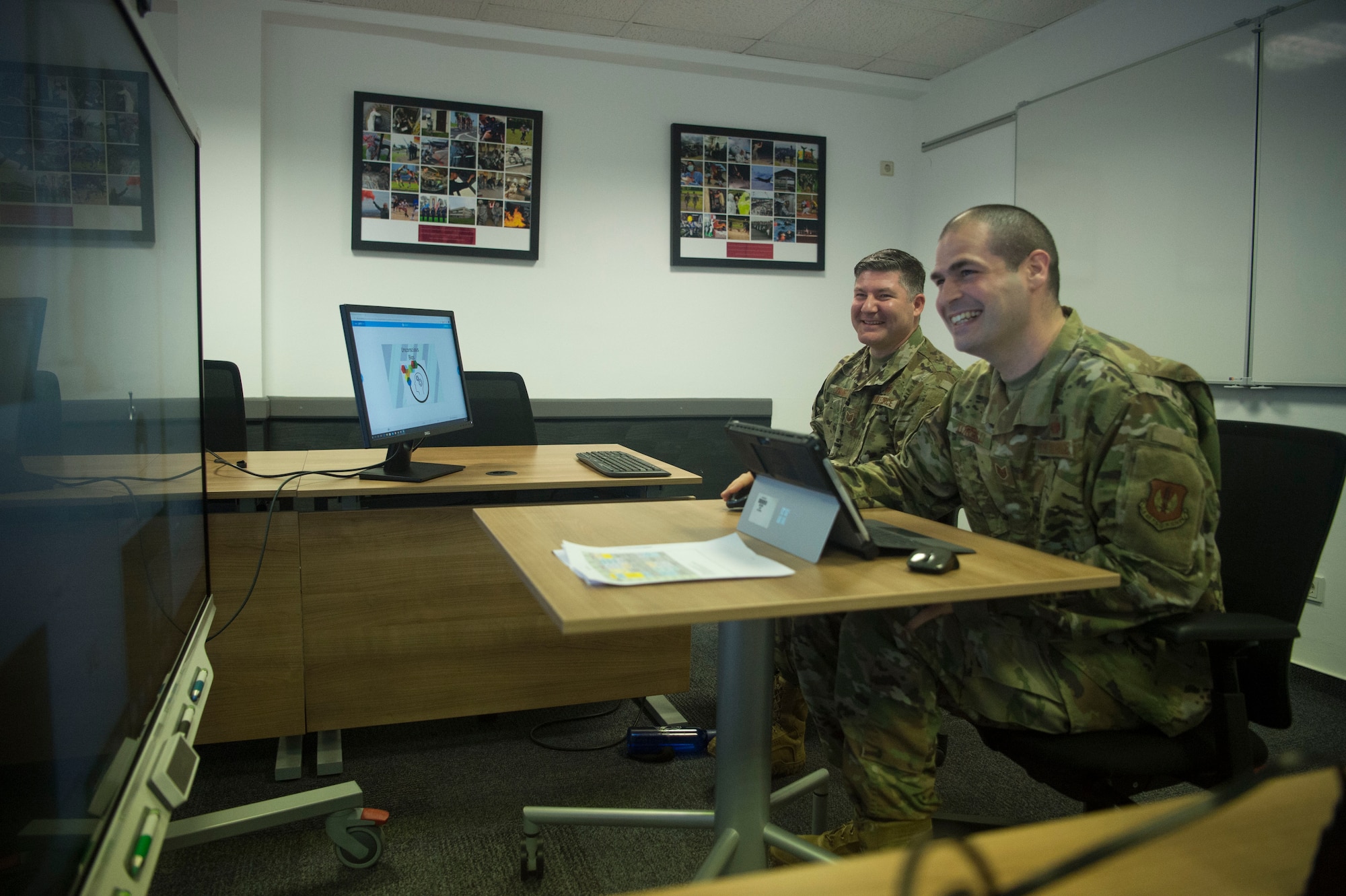 Tech. Sgts. Alex Torelli, right, and Robert Conniff, Kisling Noncommissioned Officer Academy instructors, test the virtual platforms for the upcoming online professional military education course at Kapaun Air Station, Germany, June 12, 2020. The academy cadre devoted three months in professional development training to tailor the curriculum to an online format. (U.S. Air Force photo by Tech. Sgt. Stephen Ocenosak)