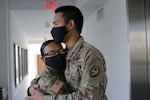 Lt. Col. Marlene Tarusan-Legaspi and her son, Pfc. Nikolas Legaspi, both with the Guam Army National Guard, find time during their COVID-19 missions to spend a moment together in Tamuning, Guam, June 8, 2020. Tarusan-Legaspi and her son were activated to support the government of Guam’s response to the COVID-19 pandemic.