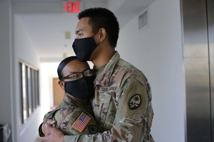 Lt. Col. Marlene Tarusan-Legaspi and her son, Pfc. Nikolas Legaspi, both with the Guam Army National Guard, find time during their COVID-19 missions to spend a moment together in Tamuning, Guam, June 8, 2020. Tarusan-Legaspi and her son were activated to support the government of Guam’s response to the COVID-19 pandemic.