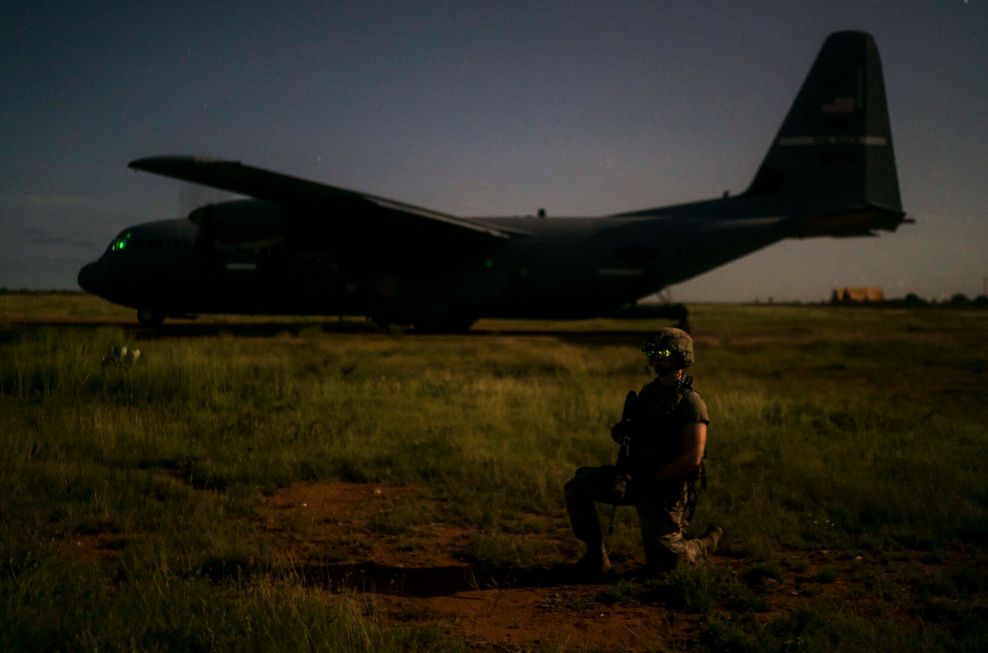 U.S. Army Spc. Kameron Cempa, Site Security Team Task Force Guardian, 1st Battalion, 186th Infantry Brigade Combat Team infantryman, provides security for a C-130J Super Hercules from the 75th Expeditionary Airlift Squadron (EAS) in Somalia, June 6, 2020. The 75th EAS provides strategic Airlift capabilities across the Combined Joint Task Force - Horn of Africa (CJTF-HOA) area of responsibility. (U.S. Air Force photo by Staff Sgt. Shawn White)