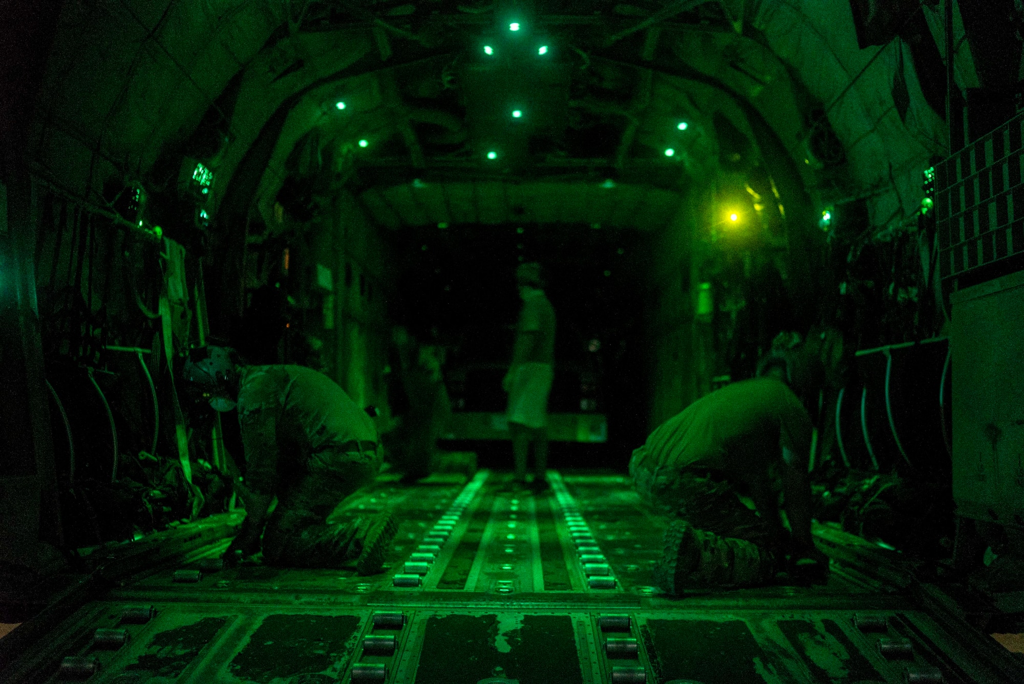 U.S. Air Force Airmen with the 75th Expeditionary Airlift Squadron (EAS) prepare to load cargo onto a C-130J Super Hercules Somalia, June 6, 2020. The 75th EAS provides strategic Airlift capabilities across the Combined Joint Task Force - Horn of Africa (CJTF-HOA) area of responsibility. (U.S. Air Force photo by Staff Sgt. Shawn White)