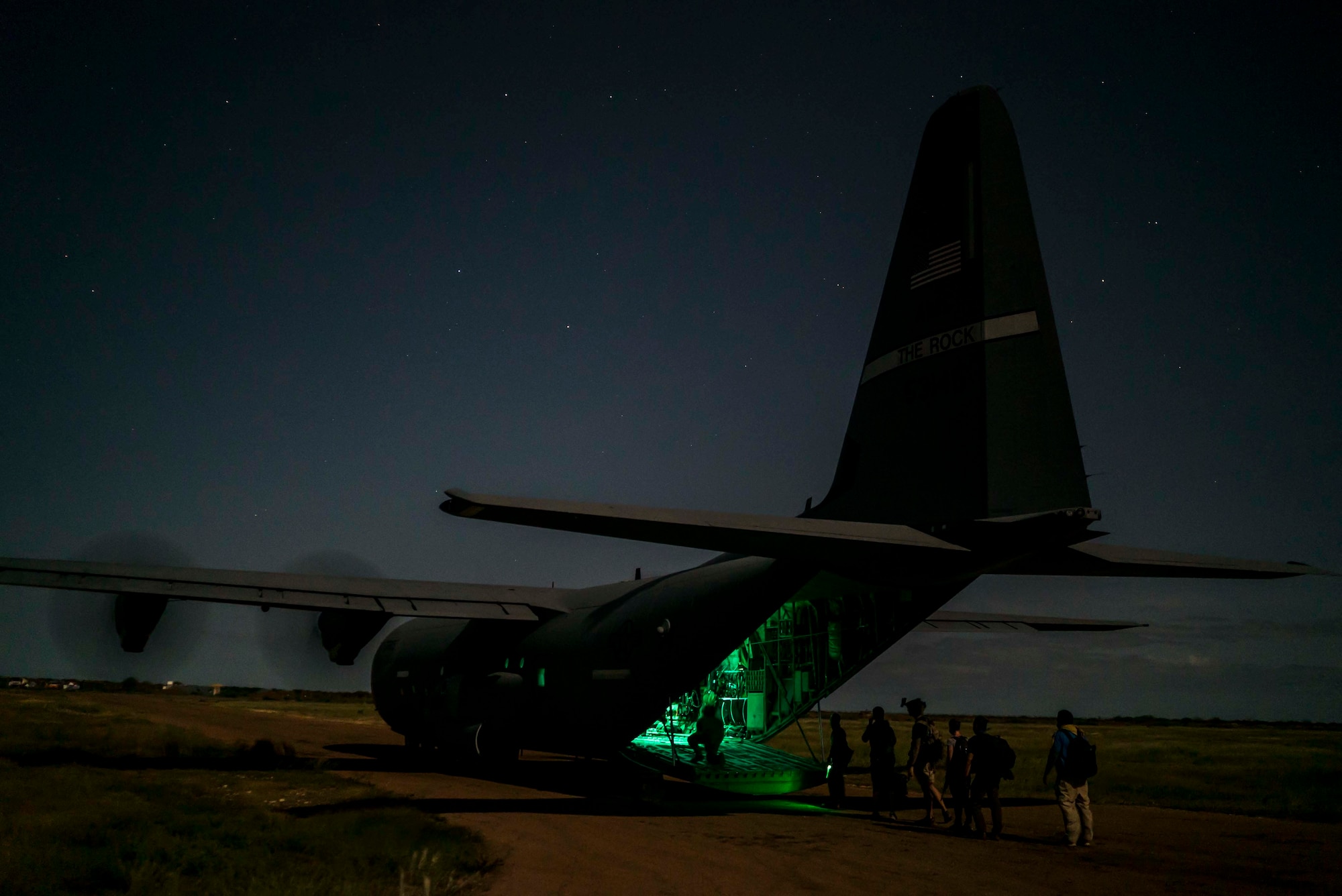 A U.S. Air Force C-130J Super Hercules from the 75th Expeditionary Airlift Squadron (EAS), onloads Department of Defense personnel in Somalia, June 6, 2020. The 75th EAS provides strategic Airlift capabilities across the Combined Joint Task Force - Horn of Africa (CJTF-HOA) area of responsibility. (U.S. Air Force photo by Staff Sgt. Shawn White)