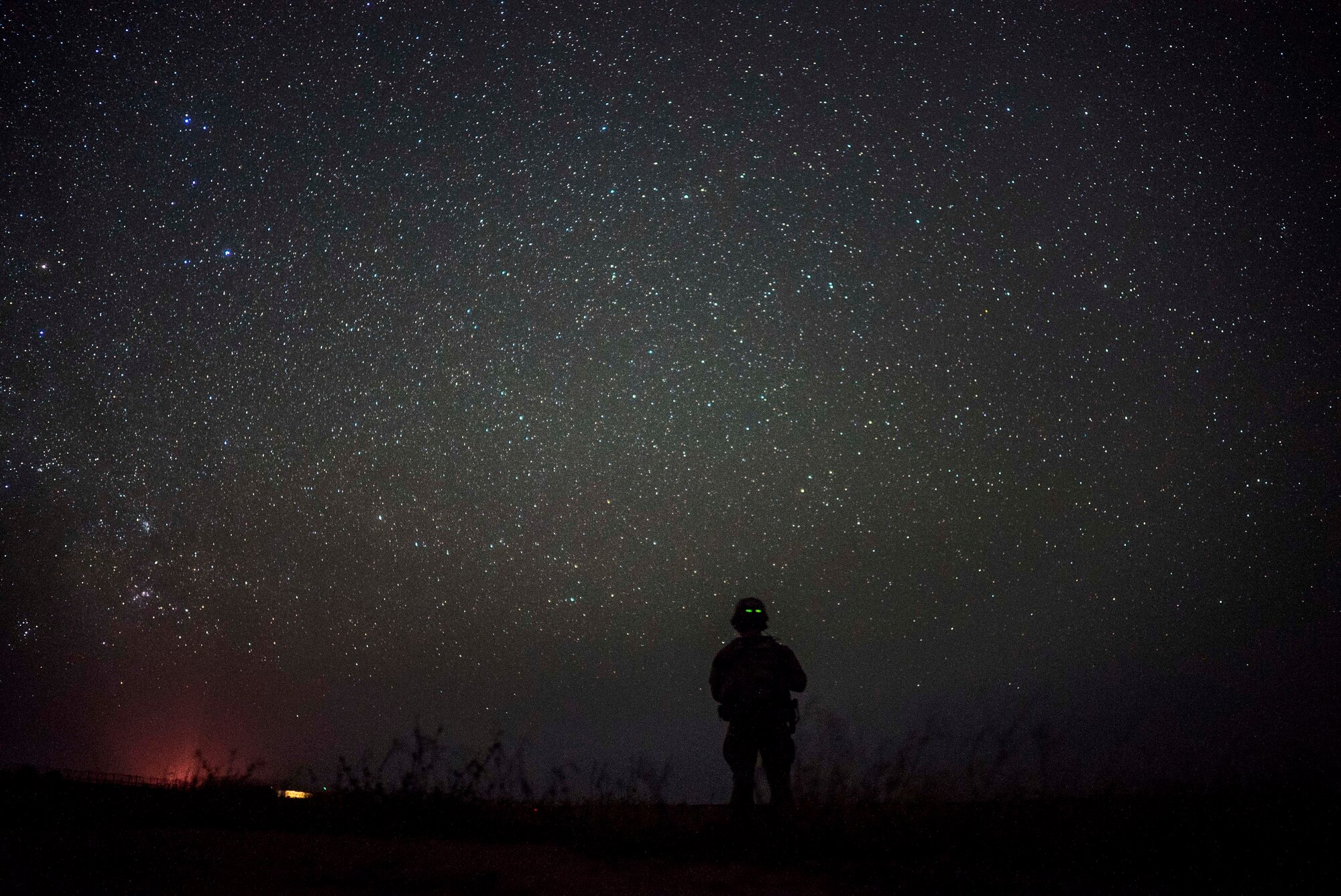 A U.S. Army soldier assigned to Site Security Team Task Force Guardian, 1st Battalion, 186th Infantry Brigade Combat Team, provides security for a C-130J Super Hercules from the 75th Expeditionary Airlift Squadron (EAS) in Somalia, June 10, 2020. The 75th EAS provides strategic airlift capabilities across the Combined Joint Task Force - Horn of Africa (CJTF-HOA) area of responsibility. (U.S. Air Force photo by Staff Sgt. Shawn White)