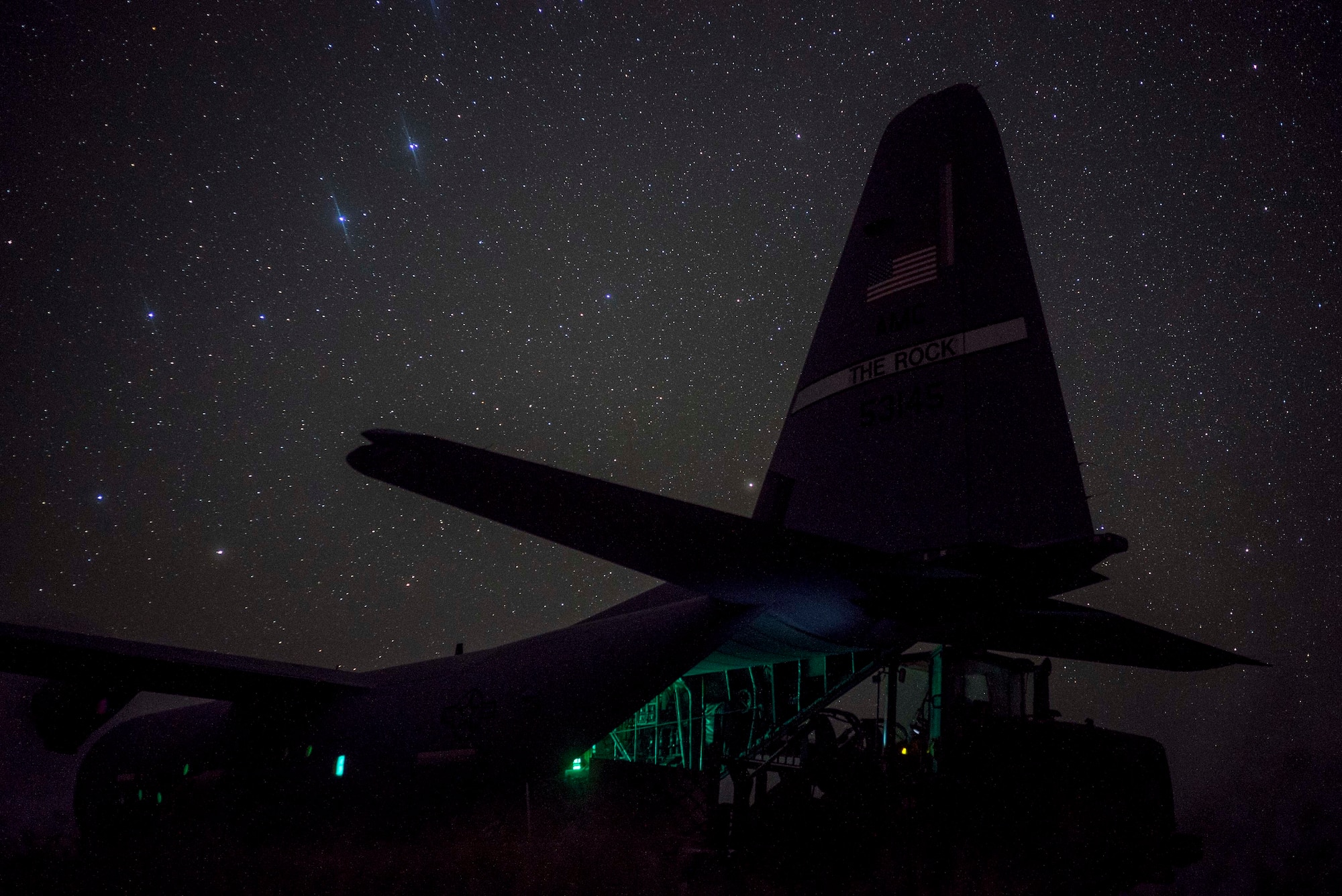 A U.S. Air Force C-130J Super Hercules from the 75th Expeditionary Airlift Squadron (EAS), onloads Department of Defense personnel in Somalia, June 10, 2020. The 75th EAS provides strategic airlift capabilities across the Combined Joint Task Force - Horn of Africa (CJTF-HOA) area of responsibility. (U.S. Air Force photo by Staff Sgt. Shawn White)