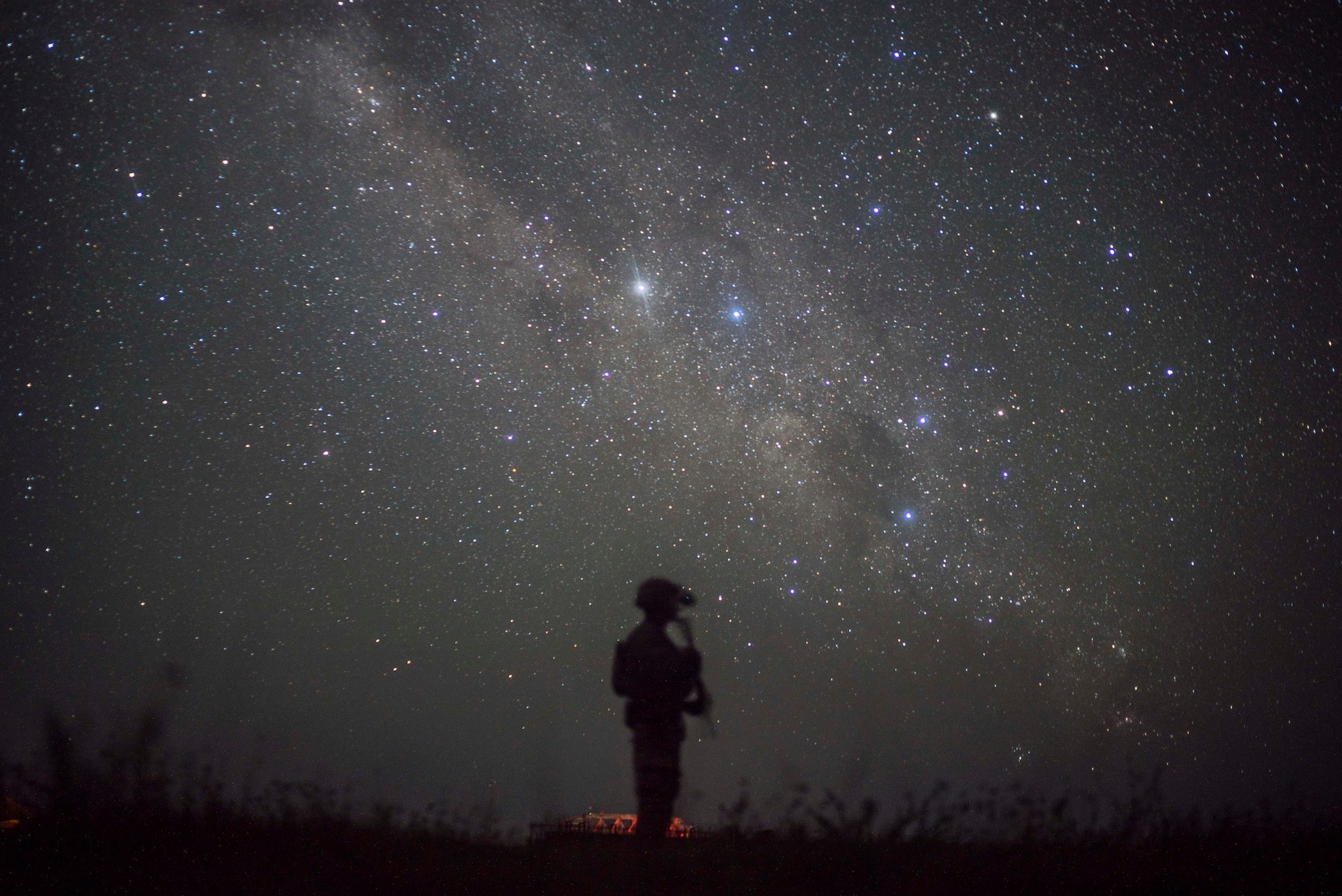 A U.S. Army soldier assigned to Site Security Team Task Force Guardian, 1st Battalion, 186th Infantry Brigade Combat Team, provides security for a C-130J Super Hercules from the 75th Expeditionary Airlift Squadron (EAS) in Somalia, June 10, 2020. The 75th EAS provides strategic airlift capabilities across the Combined Joint Task Force - Horn of Africa (CJTF-HOA) area of responsibility. (U.S. Air Force photo by Staff Sgt. Shawn White)