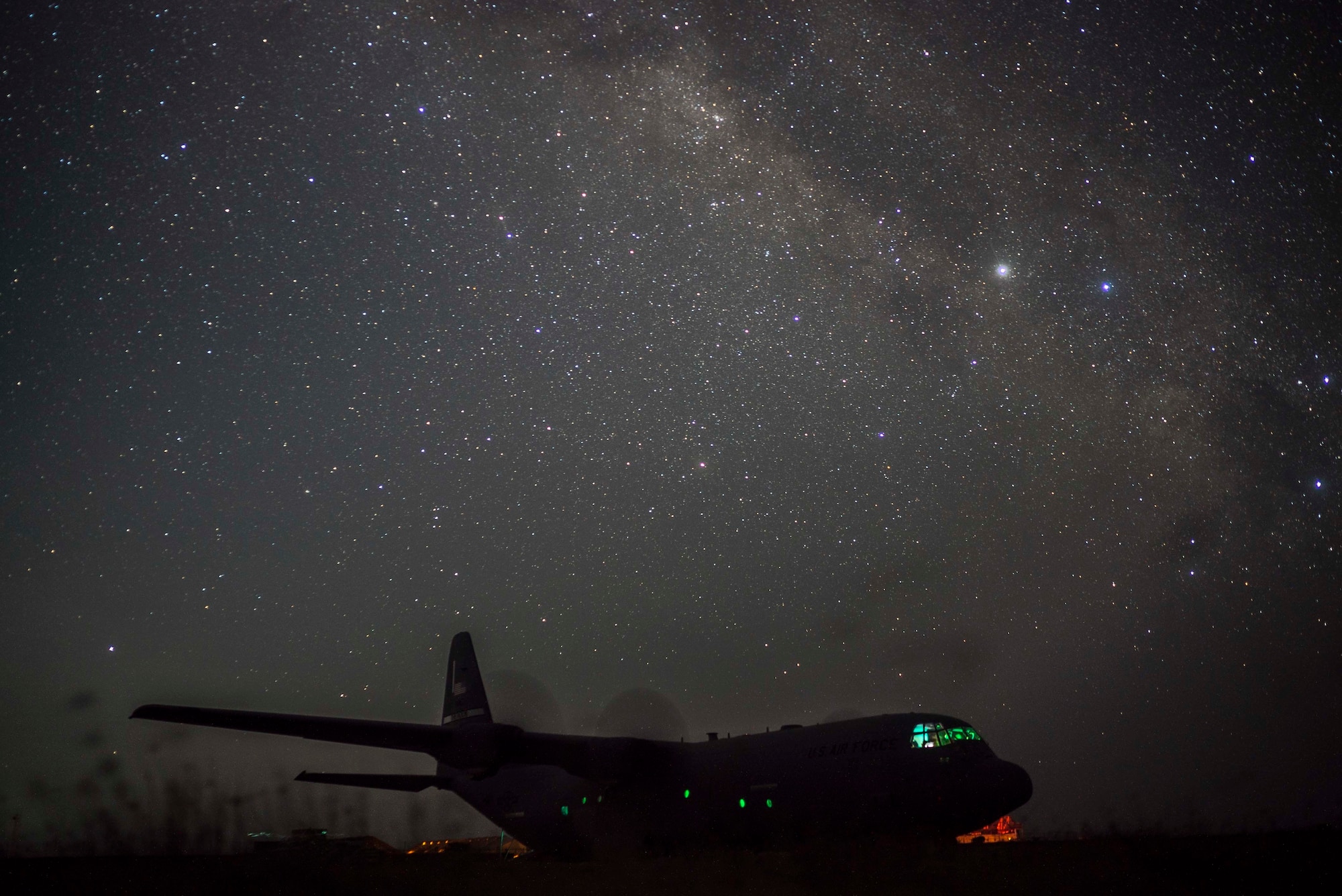 A U.S. Air Force C-130J Super Hercules from the 75th Expeditionary Airlift Squadron (EAS), onloads Department of Defense personnel in Somalia, June 10, 2020. The 75th EAS provides strategic airlift capabilities across the Combined Joint Task Force - Horn of Africa (CJTF-HOA) area of responsibility. (U.S. Air Force photo by Staff Sgt. Shawn White)