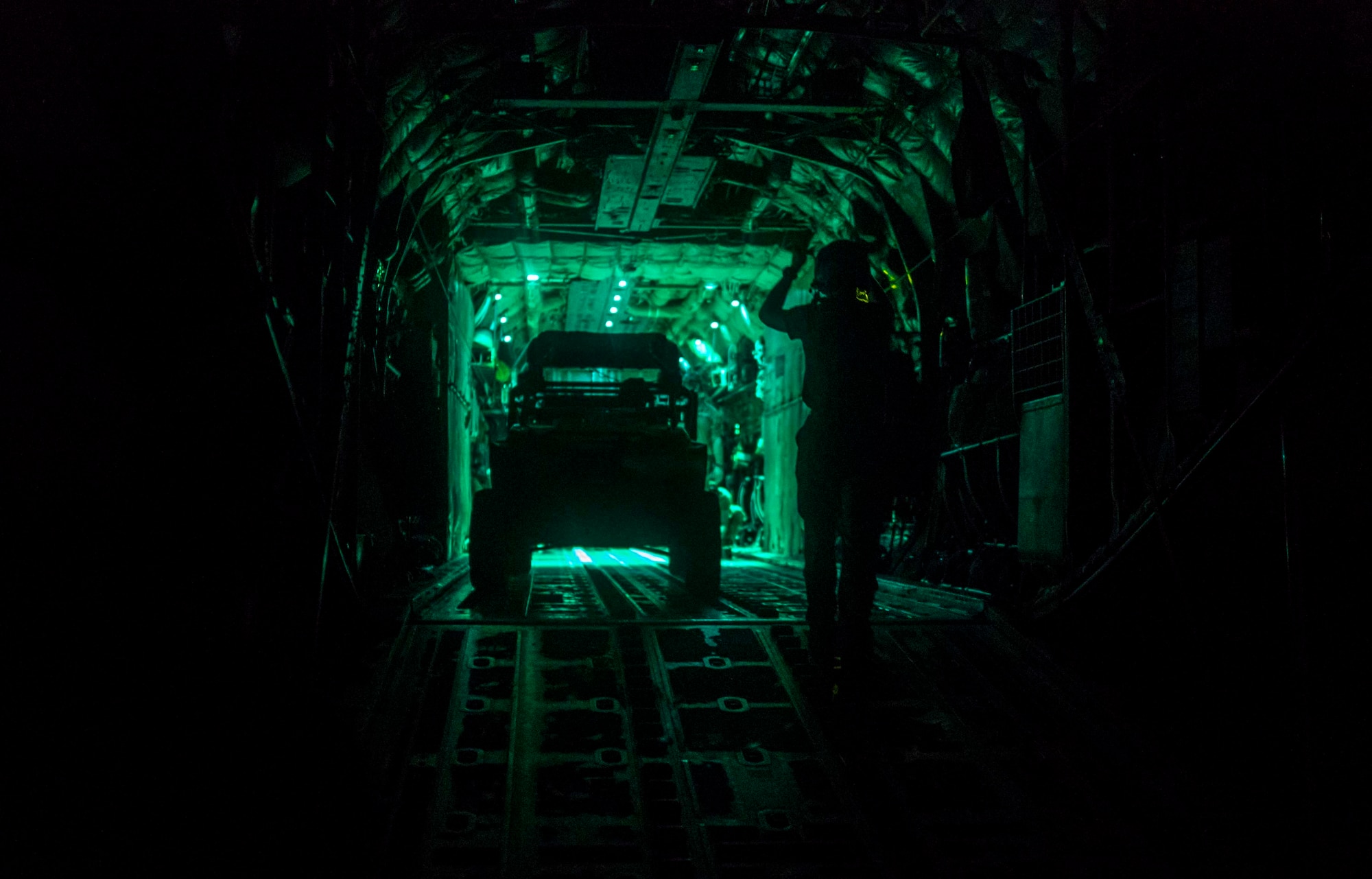 U.S. Air Force loadmasters from the 75th Expeditionary Airlift Squadron (EAS) load cargo onto a C-130J Super Hercules in Somalia, June 10, 2020. The 75th EAS provides strategic airlift capabilities across the Combined Joint Task Force - Horn of Africa (CJTF-HOA) area of responsibility. (U.S. Air Force photo by Staff Sgt. Shawn White)