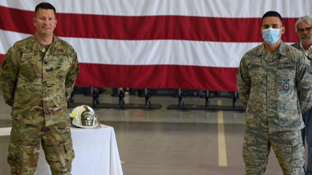 U.S. Air Force Lt. Col. Michael McCourt, 312th Training Squadron commander, poses with Tech. Sgt. Alexander Spears, 312th TRS fire instructor, who won the Department of Defense Fire Academy U.S. Air Force Instructor of the Year Award at the Louis F. Garland DoD Fire Academy on Goodfellow Air Force Base, Texas, June 5, 2020. All DoD firefighters are trained in a joint service environment. (U.S. Air Force photo by Airman 1st Class Ethan Sherwood)