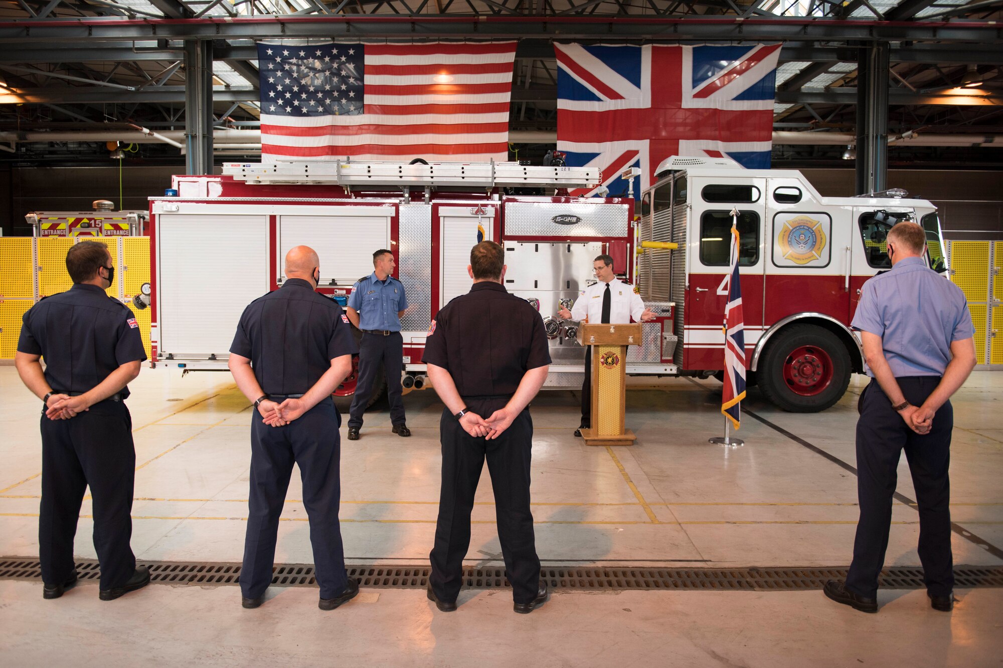 Lee Joyce, 423rd Civil Engineer Squadron lead firefighter, is awarded the Fire Department’s Life Saving Medal at RAF Alconbury, England, June 16, 2020, for saving his daughter’s life. Lee utilized his firefighter training to assist his four-year-old daughter when she was chocking on a chocolate egg May 16, 2020. (U.S. Air Force photo by Airman 1st Class Jennifer Zima)