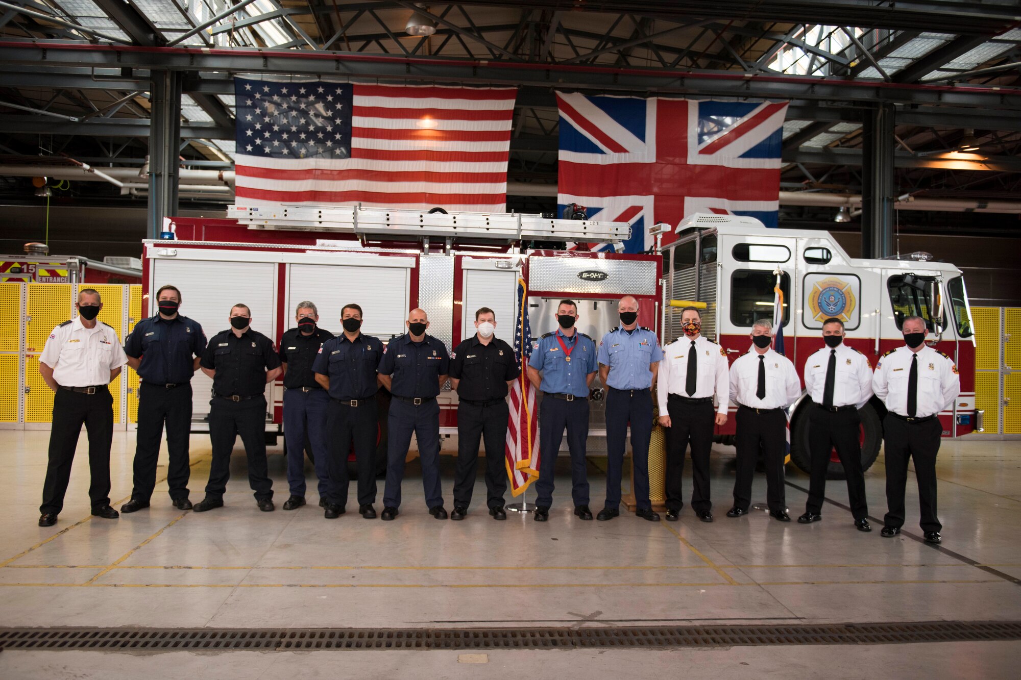 Lee Joyce, 423rd Civil Engineer Squadron lead firefighter, is awarded the Fire Department’s Life Saving Medal at RAF Alconbury, England, June 16, 2020, for saving his daughter’s life. Lee utilized his firefighter training to assist his four-year-old daughter when she was chocking on a chocolate egg May 16, 2020. (U.S. Air Force photo by Airman 1st Class Jennifer Zima)
