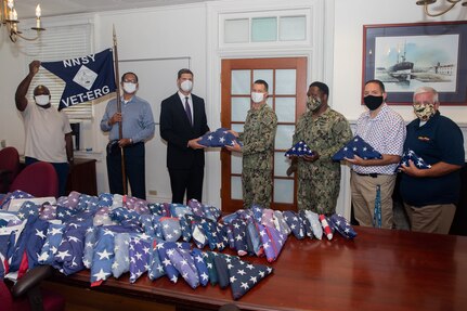 Norfolk Naval Shipyard’s Veteran Employee Readiness Group (VET-ERG) presented 113 U.S. Flags to Sturtevant Funeral Home June 12 in honor of Flag Day. The flags were donated from the workforce and from within the community to be part of Sturtevant’s Retire the Flag Program. From Left to Right: VET-ERG Member Ricky Burroughs, VET-ERG Founding Member Jonathan Echols, Sturtevant Funeral Home Representative Robie Gardner, Shipyard Commander Capt. Kai Torkelson, Command Master Chief Gene Garland, VET-ERG President Nicholas Boyle, and Retired/VET-ERG Founding Member Rick Nelson.