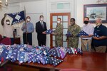 Norfolk Naval Shipyard’s Veteran Employee Readiness Group (VET-ERG) presented 113 U.S. Flags to Sturtevant Funeral Home June 12 in honor of Flag Day. The flags were donated from the workforce and from within the community to be part of Sturtevant’s Retire the Flag Program. From Left to Right: VET-ERG Member Ricky Burroughs, VET-ERG Founding Member Jonathan Echols, Sturtevant Funeral Home Representative Robie Gardner, Shipyard Commander Capt. Kai Torkelson, Command Master Chief Gene Garland, VET-ERG President Nicholas Boyle, and Retired/VET-ERG Founding Member Rick Nelson.