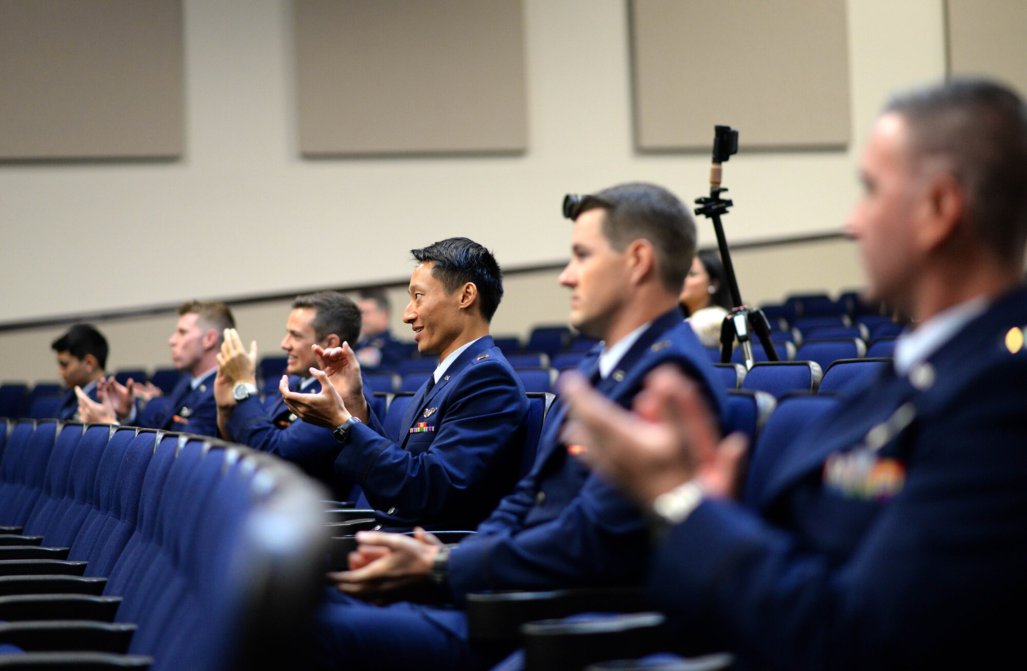 Specialized Undergraduate Pilot Training Class 20-16/17 sit in the Kaye Auditorium during their graduation ceremony June 12, 2020, on Columbus Air Force Base, Miss. The students endured a 53-week training program in order to earn the title of an Air Force pilot. (U.S. Air Force photo by Senior Airman Keith Holcomb)
