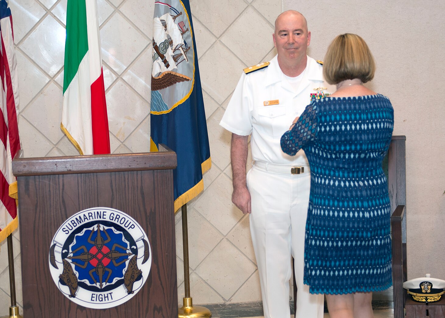 200616-N-DF478-0050 NAPLES, Italy (June 16, 2020) – Rear Adm. William J. Houston is pinned the Legion of Merit for his meritorious conduct in the performance of outstanding services and achievements while serving as Commander, Submarine Group (CSG) 8 by his wife Colleen during a change of command ceremony in Naples, Italy, June 16, 2020. Rear Adm. Anthony C. Carullo relieved Rear Adm. William J. Houston as commander of the submarine group. U.S. 6th Fleet, headquartered in Naples, Italy, conducts the full spectrum of joint and naval operations, often in concert with allied and interagency partners in order to advance U.S. national interests and security and stability in Europe and Africa. (U.S. Navy photo by Mass Communication Specialist 1st Class Marvin E. Thompson Jr.)