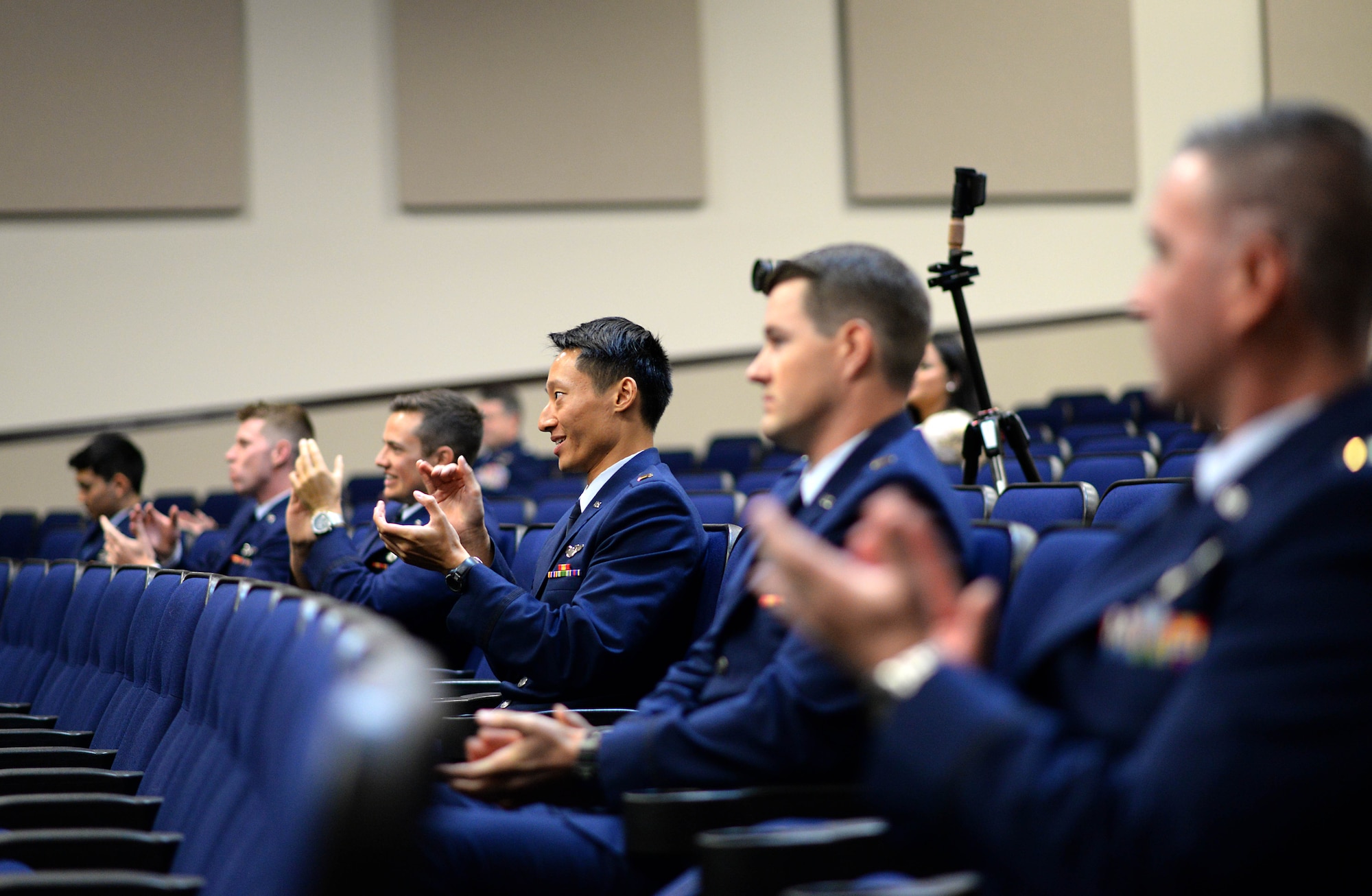 Specialized Undergraduate Pilot Training Class 20-16/17 sit in the Kaye Auditorium during their graduation ceremony June 12, 2020, on Columbus Air Force Base, Miss. The students endured a 53-week training program in order to earn the title of an Air Force pilot. (U.S. Air Force photo by Senior Airman Keith Holcomb)