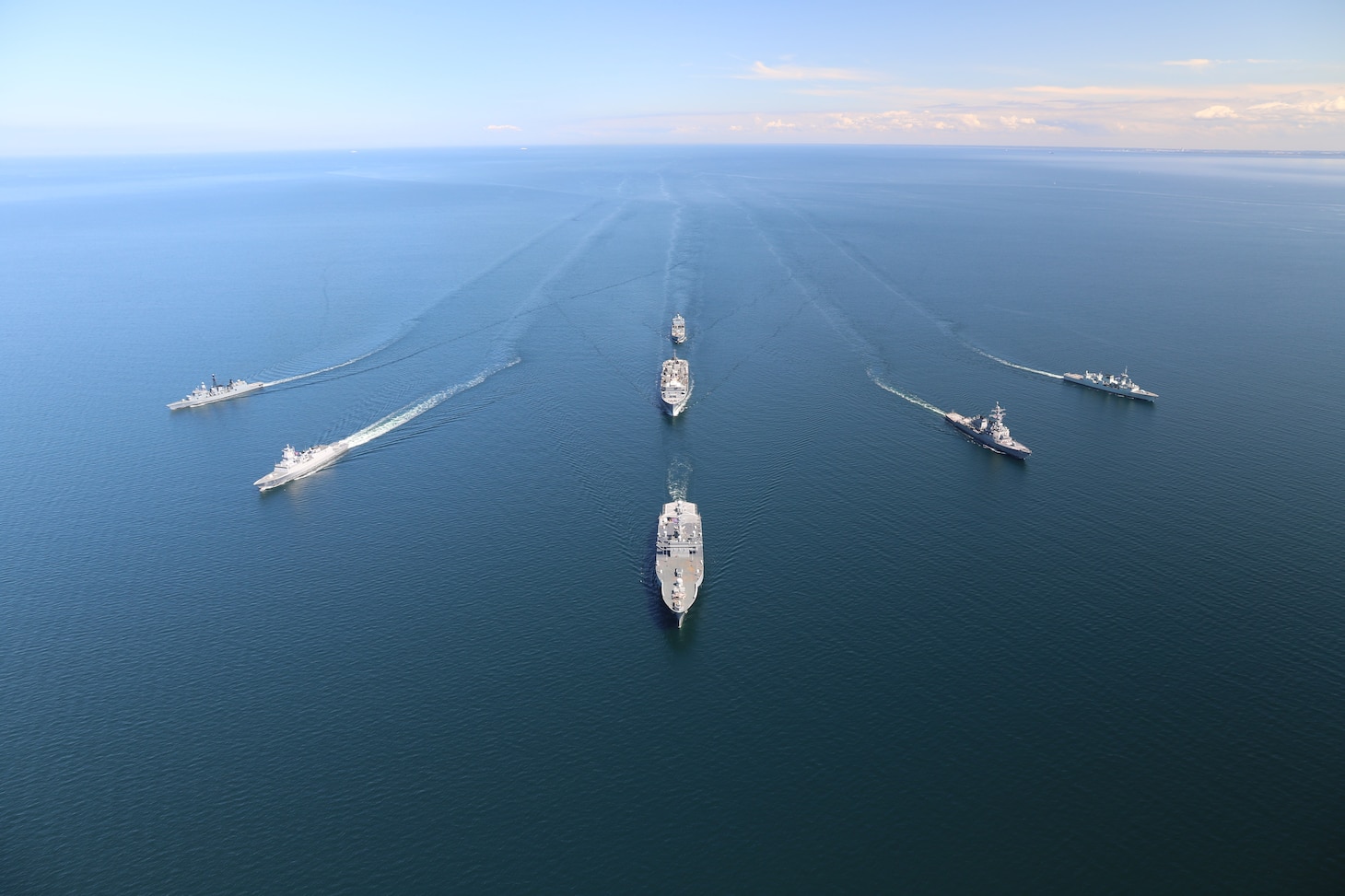 BALTIC SEA (June 8, 2020) Ships from nations participating in exercise Baltic Operations (BALTOPS) 2020 sail in formation while in the Baltic Sea, June 8, 2020. The ships pictured are (in alphabetical order by home nation): the Royal Canadian Navy Halifax-class frigate HMCS Fredericton (FFH 337), the German Navy Bremen-class frigate FGS Luebeck (F214), the German Navy Rhone-Class replenishment oiler FGS Rhoen (A1443), the Royal Norwegian Navy Fridtjof Nansen-class frigate HNoMS Otto Suerdrup (F312), the U.S. Navy Blue Ridge-class command and control ship USS Mount Whitney (LCC 20), the U.S. Navy Arleigh Burke-class guided-missile destroyer USS Donald Cook (DDG 75), and the U.S. Navy Supply-class fast-combat support ship USNS Supply (T-AOE 6). BALTOPS is the premier annual maritime-focused exercise in the Baltic Region, marking the 49th year of one of the largest exercises in Northern Europe enhancing flexibility and interoperability among allied and partner nations. (Photo courtesy of the German Navy)