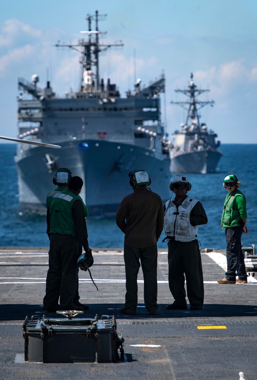 200608-N-BM428-0013 BALTIC SEA (June 8, 2020) Sailors and civil service mariners assigned to the Blue Ridge-class command and control ship USS Mount Whitney (LCC 20) wait for flight operations to begin while the U.S. Navy Supply-class fast-combat support ship USNS Supply (T-AOE 6), front, and Arleigh Burke-class guided-missile destroyer USS Donald Cook (DDG 75) sail in the background while participating in exercise Baltic Operations (BALTOPS) 2020 in the Baltic Sea, June 8, 2020. BALTOPS is the premier annual maritime-focused exercise in the Baltic Region, marking the 49th year of one of the largest exercises in Northern Europe enhancing flexibility and interoperability among allied and partner nations. (U.S. Navy photo by Mass Communication Specialist 1st Class Kyle Steckler)