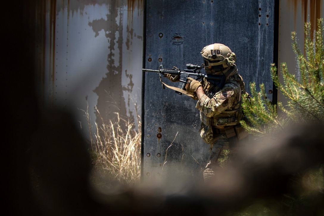 An Air National Guardsman holds a weapon.