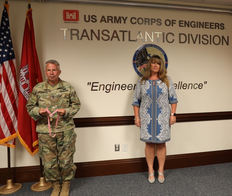 Lt. Gen. Todd T. Semonite, the 54th Chief of Engineers and Commanding General of the U.S. Army Corps of Engineers (left), presents Sally Beck with the Meritorious Public Service Medal. The award was given to Sally for all the work she did supporting families across the Army – specifically the men and women assigned to the Transatlantic Division during the command of her spouse, Col. (P) Chris Beck. Due to COVID-19 restrictions, the award was presented while practicing social distancing.