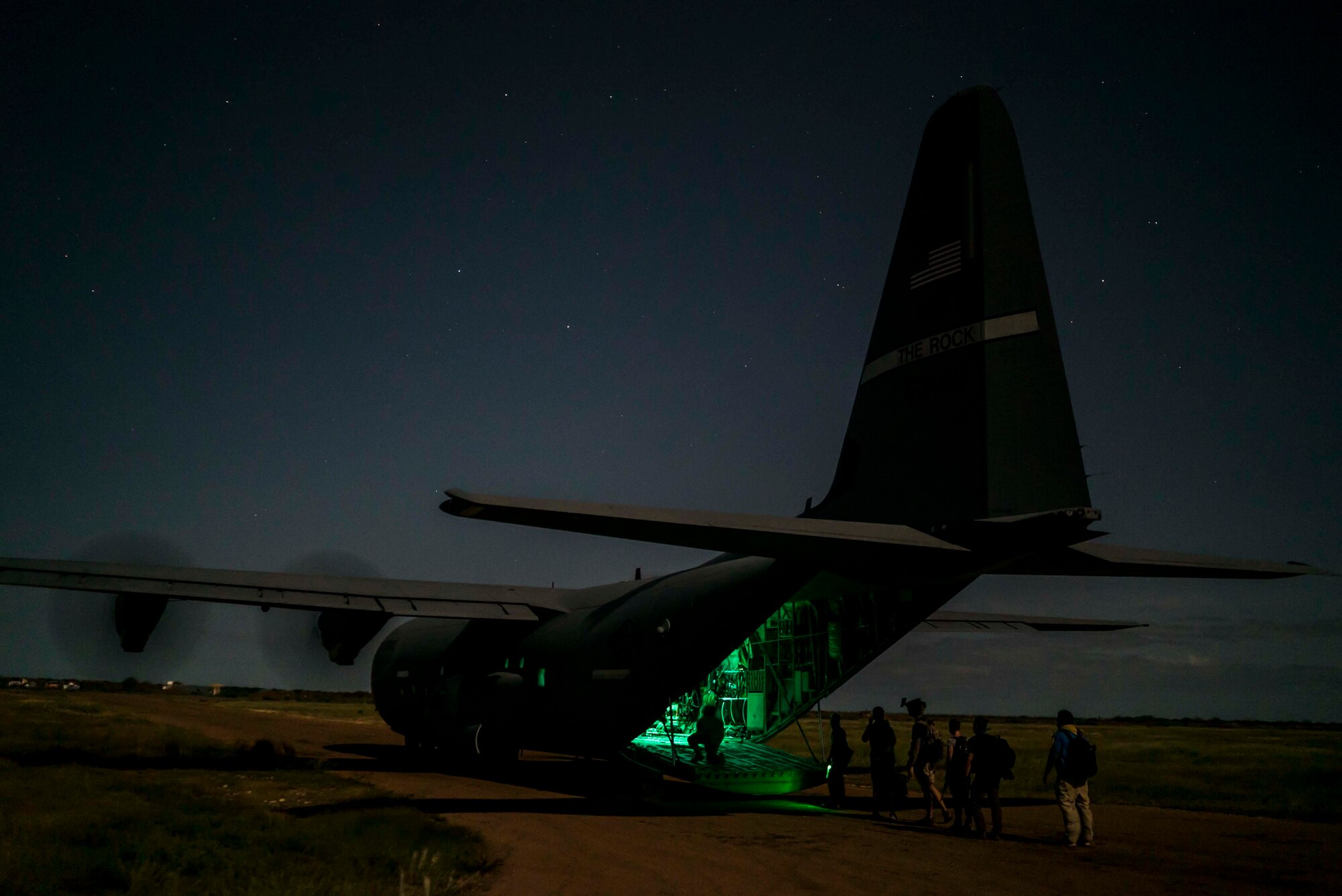 A U.S. Air Force C-130J Super Hercules from the 75th Expeditionary Airlift Squadron (EAS), onloads Department of Defense personnel in Somalia, June 6, 2020. The 75th EAS provides strategic Airlift capabilities across the Combined Joint Task Force - Horn of Africa (CJTF-HOA) area of responsibility. (U.S. Air Force photo by Staff Sgt. Shawn White)