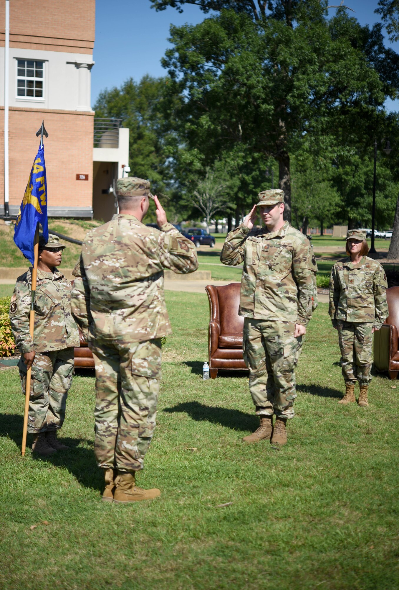 Col. David Fazenbaker (left), 14th Flying Training Wing vice wing commander returns a salute from Maj. Josh Mann, 14th Comptroller Squadron commander, at a change of command ceremony June 16, on Columbus Air Force Base, Miss. The mission of the 14th CPTS is to “Serve Airmen, Support the Mission and Finance the Fight.” (U.S. Air Force photo by Senior Airman Jake Jacobsen)