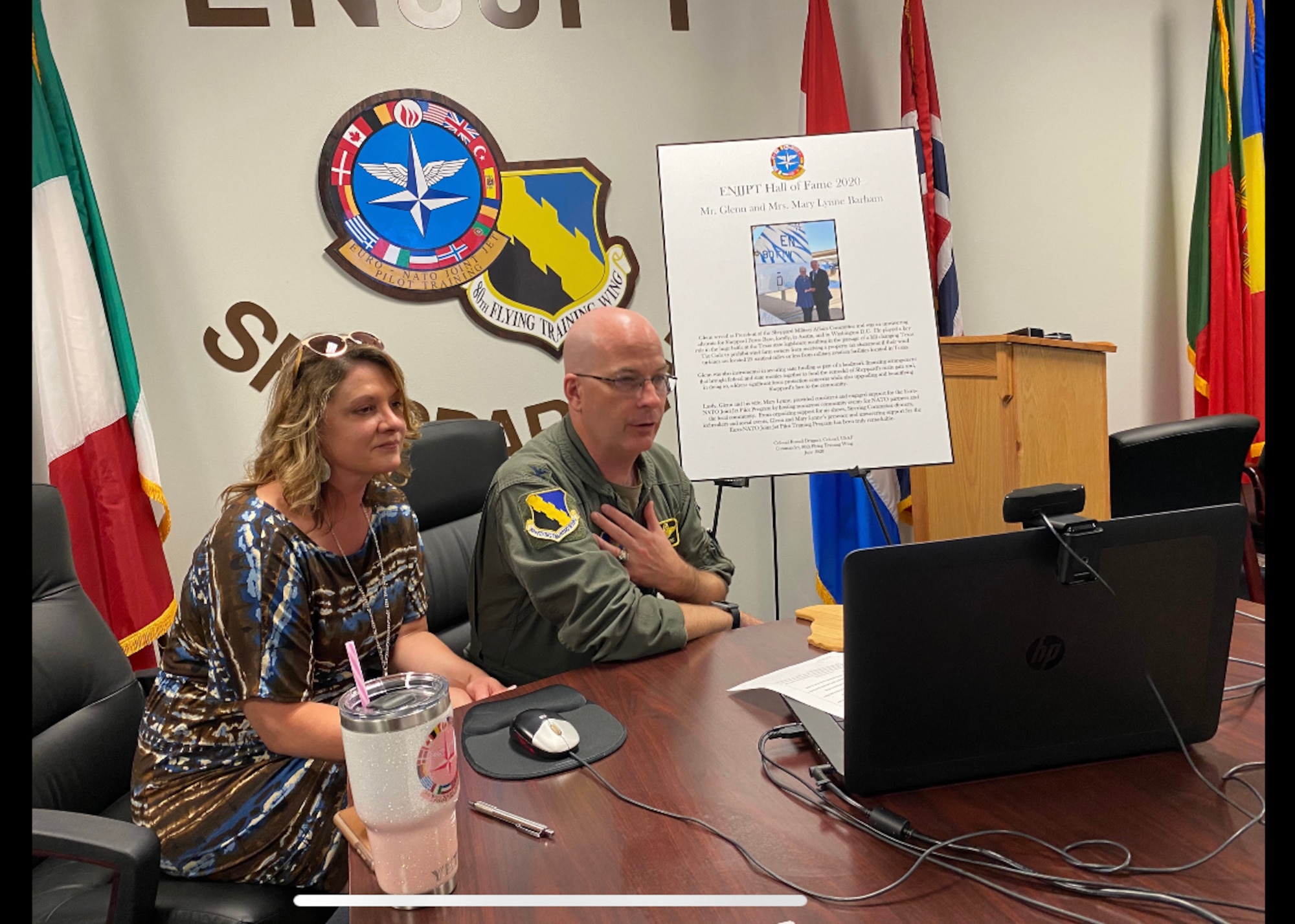 Col. Russell Driggers, 80th Flying Training Wing commander, and his wife, Janet, hold a virtual Hall of Fame induction ceremony for Glenn Barham, President of the Sheppard Military Affairs Committee, at Sheppard Air Force Base, Texas, June 15, 2020. Barham was appointed to the Euro-NATO Joint Jet Pilot Training Program's Hall of Fame for all of his support towards the 80th Flying Training Wing. (U.S. Air Force photo by 2nd Lt. Megan Morrissey)