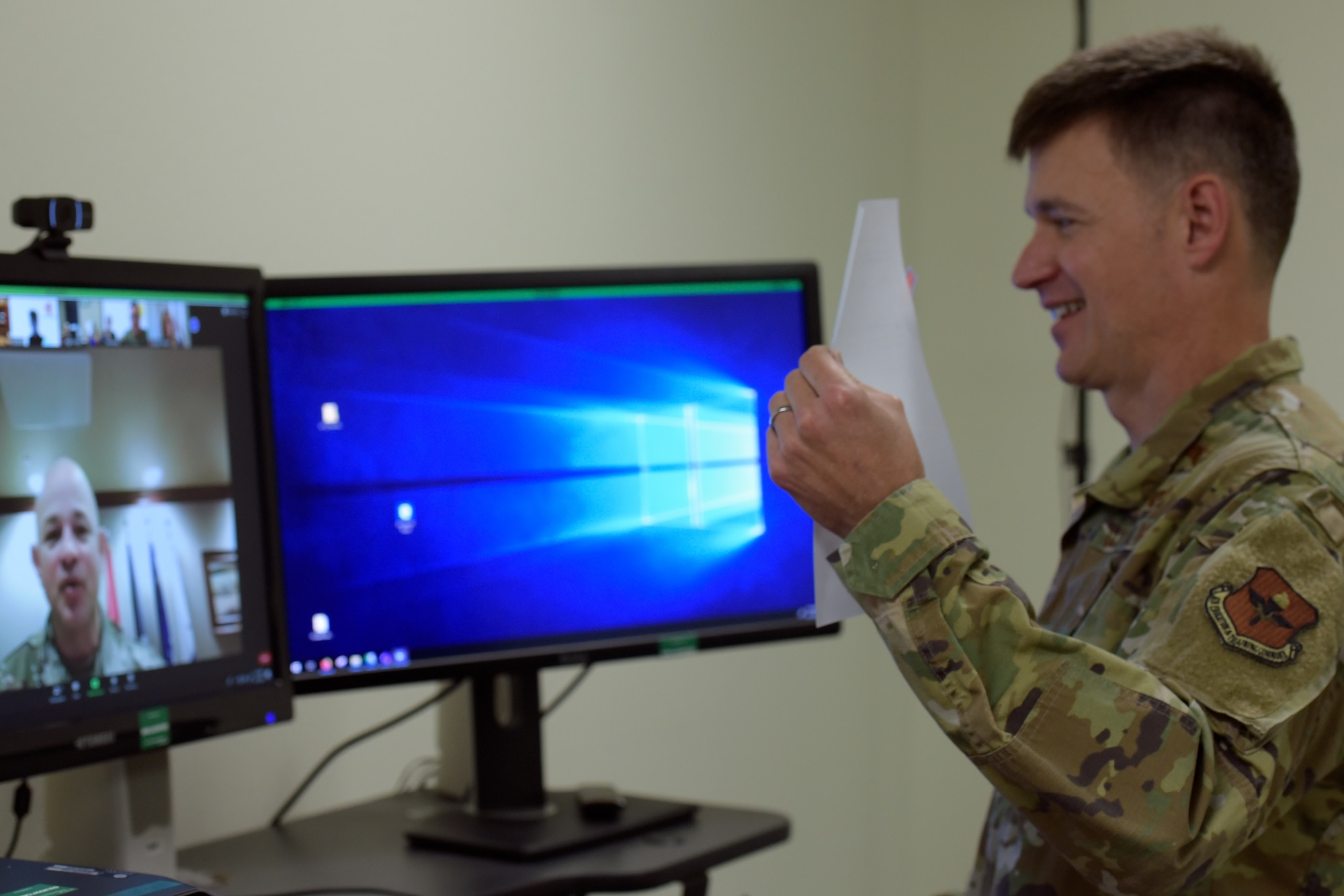 U.S. Air Force Col. Thomas Coakley, 17th Training Group commander, shows the virtually present Col. Andres Nazario, 17th Training Wing commander, the Memorandum of Understanding before signing it into effect in the Brandenburg Hall on Goodfellow Air Force Base, Texas, June 11, 2020. This MOU officially solidified several years of previous partnerships and cooperation between the 17 Training Group and Angelo State University, Howard College, San Angelo Independent School District. (U.S. Air Force photo by Senior Airman Zachary Chapman)