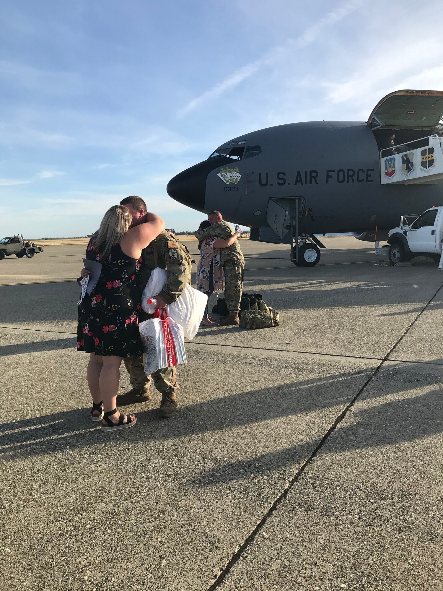 Two couples embrace in hugs June 14, 2020, at Beale Air Force Base, California.
